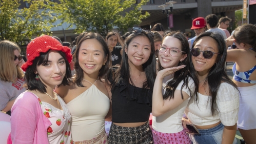 A group of student pose for a photo during the Involvement Fair on campus.