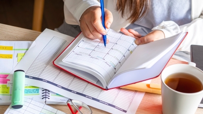 A student writes in a date planner