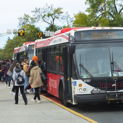 Students lining up to get on the bus