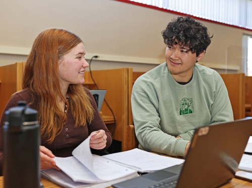 Two students talking and studying