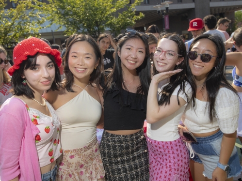 A group of student pose for a photo during the Involvement Fair on campus.