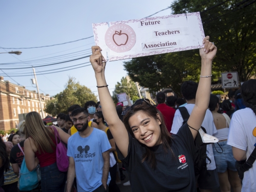 Person holding a sign for Future Teachers Association