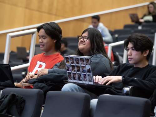Students sit in a lecture hall course inside the Rutgers Business School.