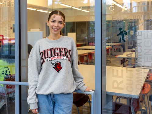 Bianca La Fata, SEBS’25, stands outside the College Ave Learning Centers